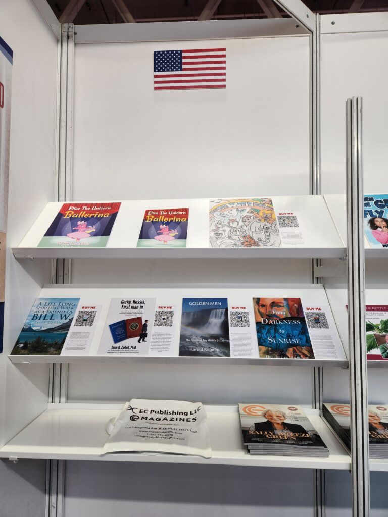 Assorted books and magazines neatly displayed on a wall shelf.