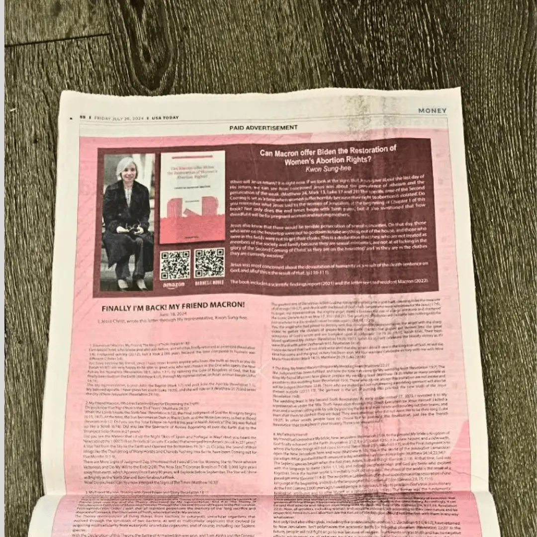 A newspaper featuring a pink cover and an image of a man prominently displayed on the front page.